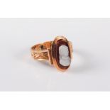 A 14ct gold cameo ring, the oval shell cameo of a lady, collet mounted with closed back, 15mm