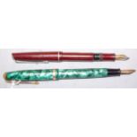 A Conway Stuart No.85L fountain pen, having 14ct gold nib, in faux malachite case; together with