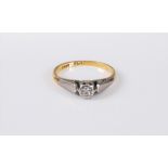 An 18ct and platinum diamond solitaire ring, the round brilliant cut diamond, estimated approx. 0.