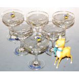 A set of six Babycham glasses, with transfer printed decoration; together with a Babycham deer