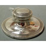 A small silver capstan inkwell, on loaded base, dia. 8.5cm