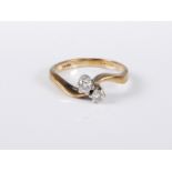 A 9ct gold two stone diamond ring, the two round brillinat cut diamonds, total estimated approx. 0.