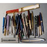 A collection of assorted ballpoint and fountain pens, to include Parker, Unique Junior etc