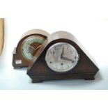 A 1930s oak cased mantel clock, having silvered dial with Arabic numerals, and chiming movement;