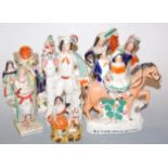 A collection of Victorian and later Staffordshire flatback figures, to include Returning Home,