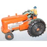 A mid 20th century battery operated model of a reversible diesel electric tractor