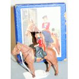 A boxed Timpo painted lead model of Queen Elizabeth II riding side-saddle on horseback