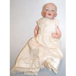 A 20th century bisque head doll having blue glass eyes and open mouth with composition body and