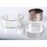 A silver hinged bangle, the 15mm wide hinged bangle, half bright cut engraved, hallmarked Birmingham