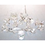 A collection of principally Swarovski cut crystal ornaments to include owl, teddy bears, elephant,