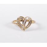 A '10k' diamond heart shaped ring, the overlocking ribbon forming an open heart shape, set with