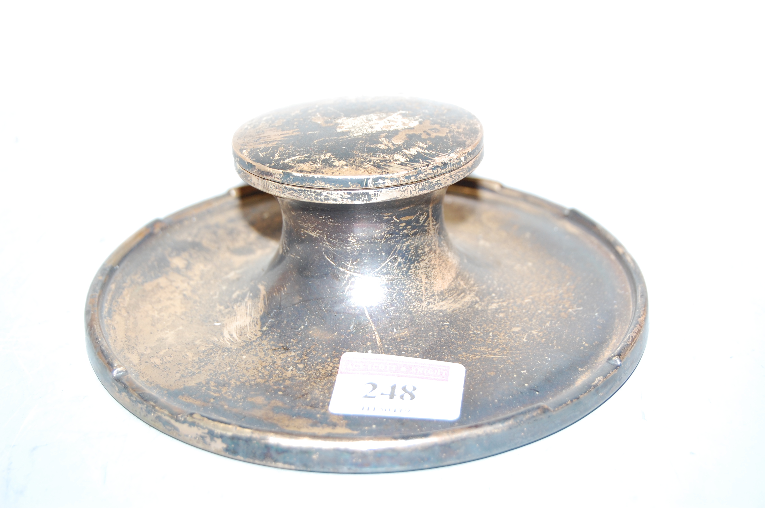 A silver capstan inkwell, on loaded base, dia.15cm
