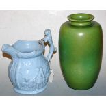 A Victorian blue glazed earthenware jug depicting Mr Isaac van Amberg performing with lions,
