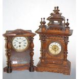 A late 19th century Continental oak cased mantel clock, having painted dial with Arabic numerals,