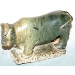 A carved soapstone figure of a bull, in standing pose, h.11cm