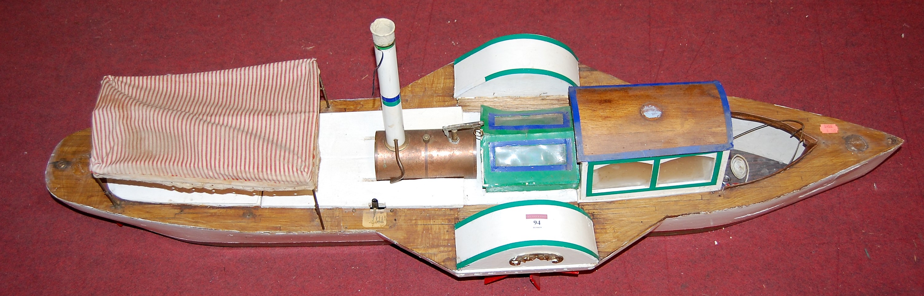 A large battery operated scratch built model of a paddle steamer, length 123cm