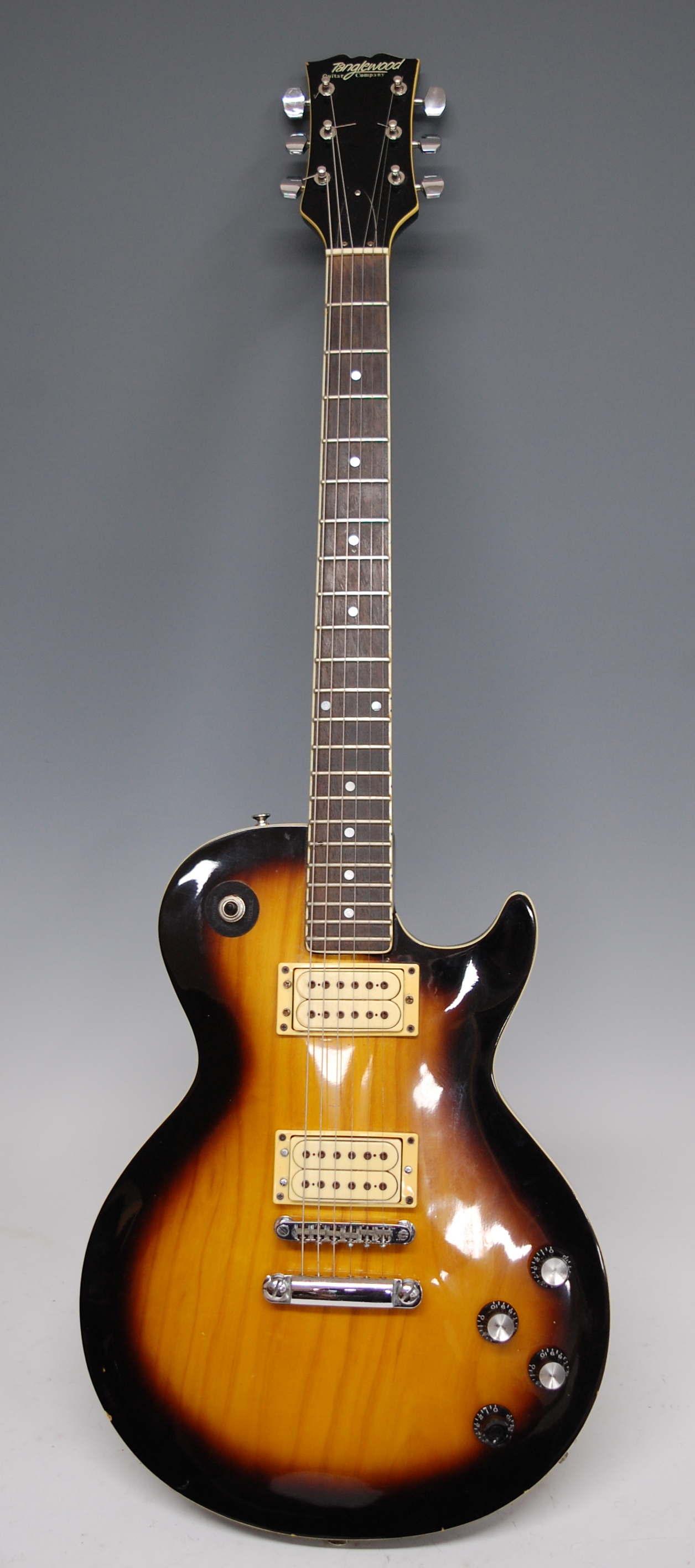 A six-string electric sunburst guitar by Tanglewood Guitar Company, in soft carry case (1)