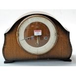 A 1950s Smiths Tempora oak cased mantel clock, having Arabic numerals and eight day chiming