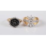 A 9ct gold black and white diamond cluster ring, estimated approx. 0.74cts, stamped with Common