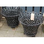 A pair of black painted cast metal and pierced circular planters, dia. 42.5cm