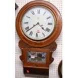 A Victorian mahogany circular drop trunk wall clock, the white enamel dial with lozenge shape