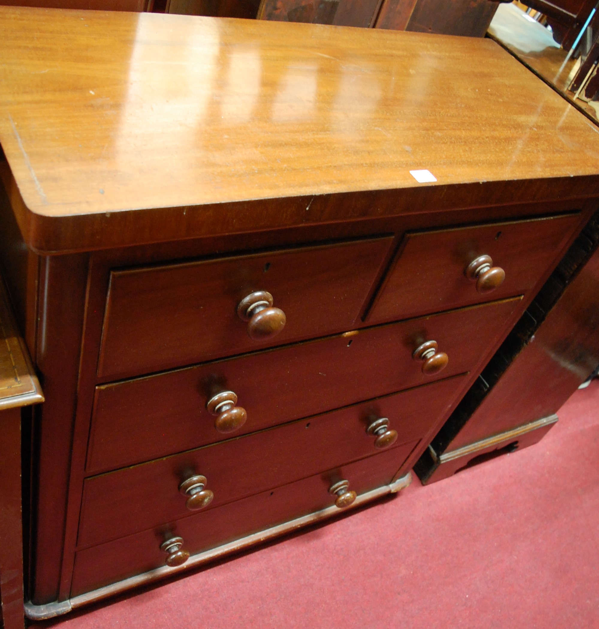 A mid-Victorian mahogany round cornered chest, of two short over three long drawers, w.98cm