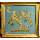 A late George III silkwork panel, depicting exotic birds upon branches, the tree flanked with a