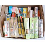 Box containing quantity of unmade mainly H0 plastic construction kits for buildings, bridges and