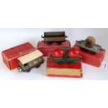 Four boxed pre-war Hornby goods wagons, 1928-30 double wine wagon, green long thin base, red barrels