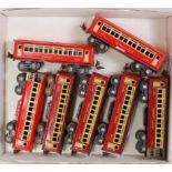 Seven Lionel Lines bogie coaches: 3 bright red and cream including observation car; 4 deeper red