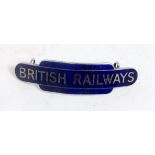 A British Railways Eastern Region blue totem cap badge