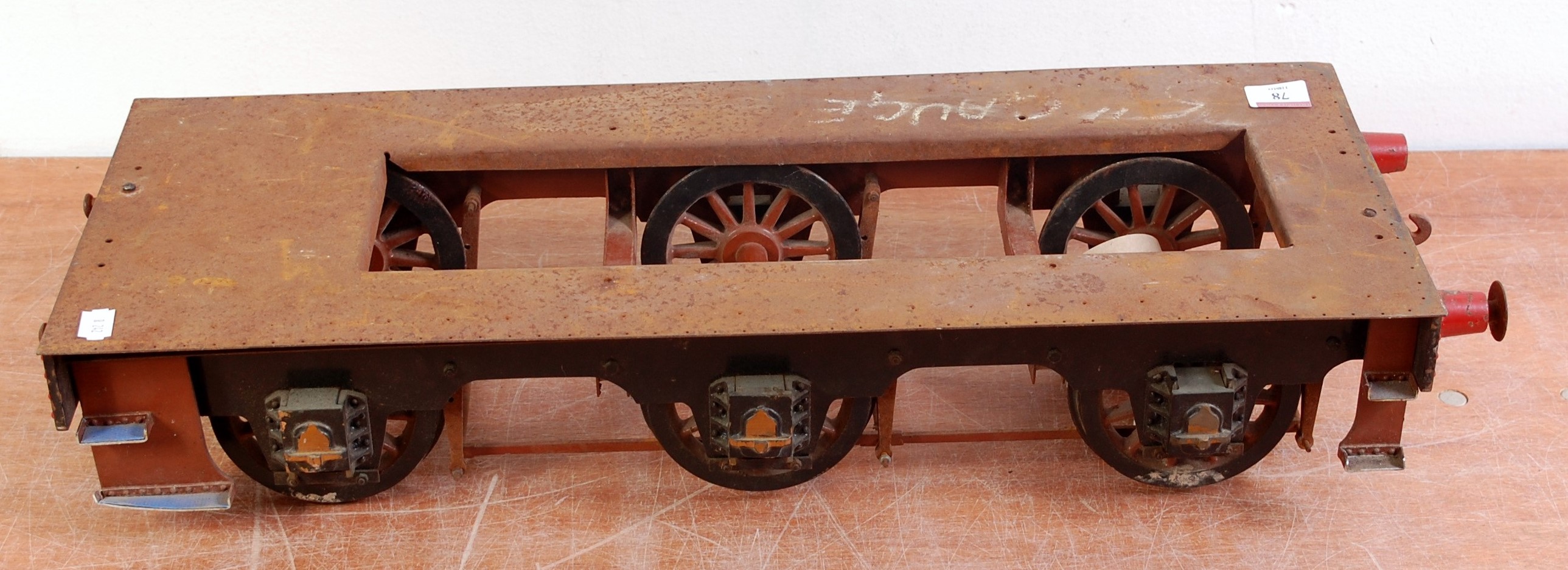 A 5" gauge part built tender chassis frame and wheels 0-6-0 configuration, model requires finishing