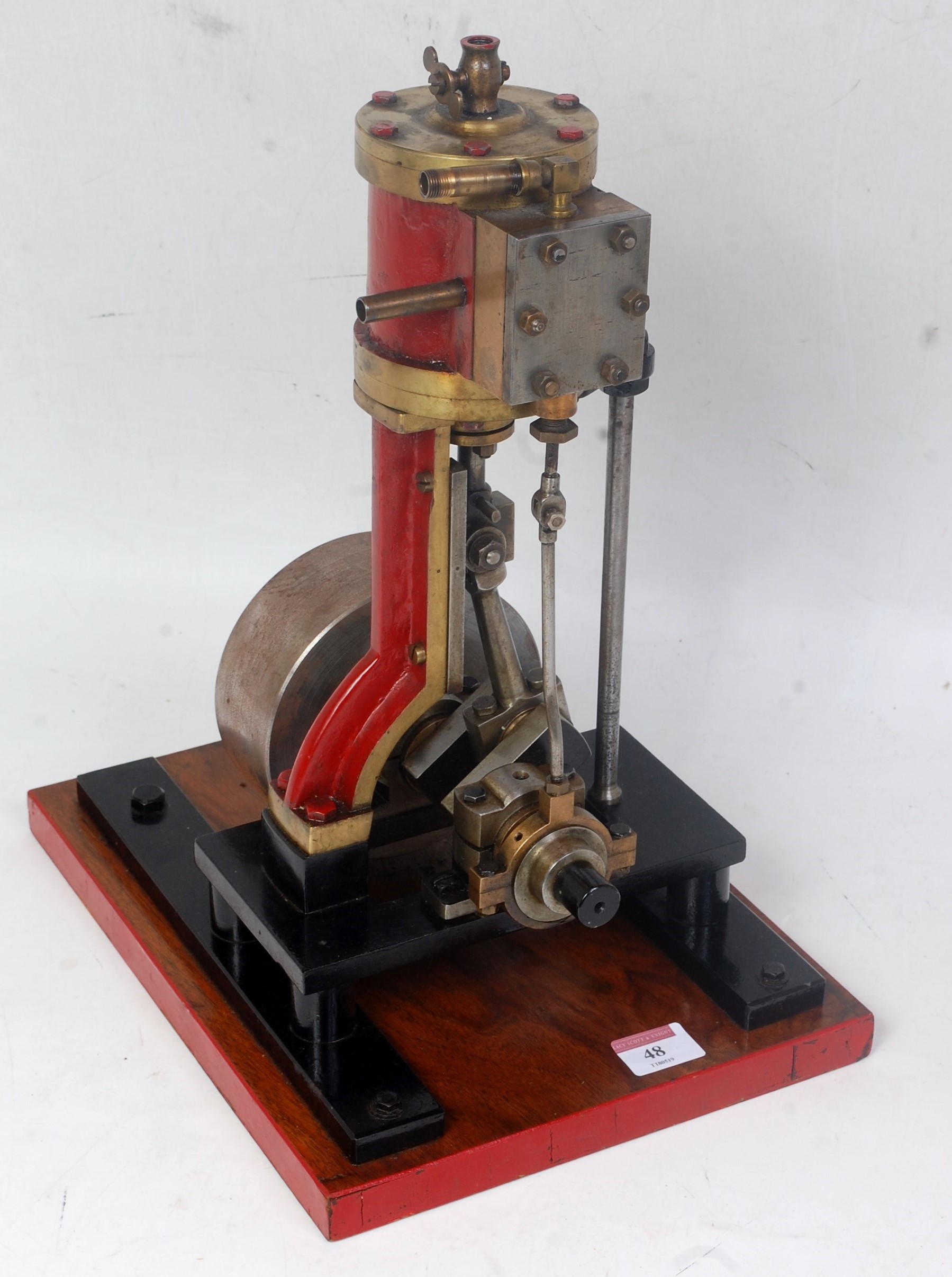 A live steam vertical Stuart Turner type steam engine comprising of a single vertical cylinder