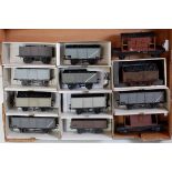 Large tray containing kit built wagons, 10 assorted coal/mineral and two goods brake vans, various