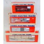 4x Lionel boxed freight items including brown Canadian National ore car No. 6126, orange Lionel