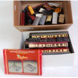Box containing C35 Triang and Hornby wagons and coaches and 3 car Blue Pullman train, a delve (a/f)