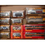 2 trays containing 16 boxed and 9 unboxed wagons and coaches, mixed makers (G-BG) and a Hornby
