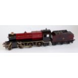 A Bassett Lowke steam, spirit fired 2-6-0 engine and tender sold for spares or repair (A/F)