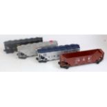 4x Lionel bogie hoppers including brown Norfolk and Western, silver Alcoa Aluminium, black Alaska RR