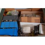 Four large trays and a cardboard sleeve containing collection from a modeller's workshop, wheels,