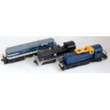 Three Lionel diesel Bo-Bo locos: AT&SF No. 6220 black, Alaska railroad No. 614 blue, and Wabash