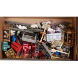 Small box containing assortment of plastic and tinplate accessories