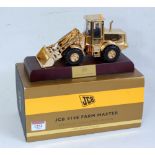 An Ertl gold plated 1:32 scale model of a JCB 414S Farm Master tractor shovel, specialist