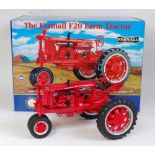 A Franklin Mint 1:12 scale model of a Farmall F20 tractor comprising red body with red and silver