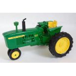 A Danbury Mint 1:16 scale model of a John Deere 4010 diesel tractor, fitted with a working clock