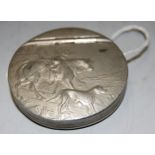 An early 20th century pewter pocket snuff box of circular form the hinged lid relief decorated
