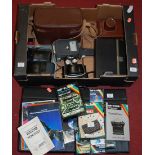 A box of assorted mid-20th century and later cameras and accessories; together with a ZX Spectrum