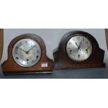 A 1930s oak cased mantel clock, having a silvered dial with Arabic numerals and chiming movement;