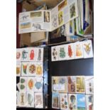 Two boxes of assorted ephemera, to include tea and cigarette cards etc