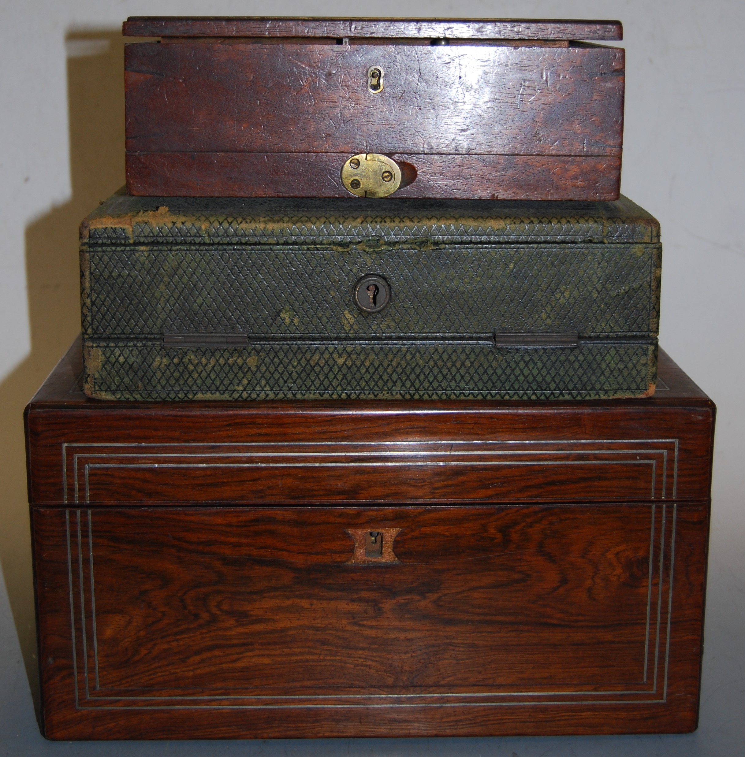 A Victorian rosewood cased lady's vanity set, the hinged lid revealing a red velvet lined fitted